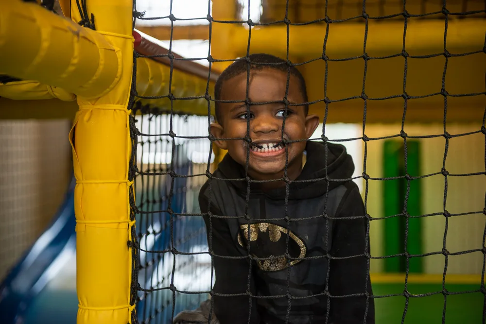 Child plays in soft play